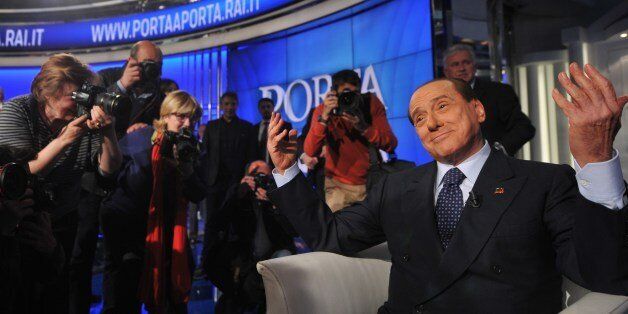 Former Italian Prime Minister Silvio Berlusconi attends the RAI 1 television programme 'Porta a Porta' on April 24, 2014 in Rome. Silvio Berlusconi officially signed up to his community service yesterday, agreeing to a court document which lays down the rules for his punishment for tax fraud. 'I signed the document,' the 77-year-old billionaire tycoon told crowds of journalists at a court office in Milan after finding out the details of his imminent community service in a Catholic Church-run old people's home. The punishment is due to last around 10 months. AFP PHOTO / TIZIANA FABI (Photo credit should read TIZIANA FABI/AFP/Getty Images)