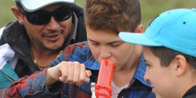 A youngster smokes marijuana during the World Day for the Legalization of Marijuana on May 3, 2014 in Montevideo. Uruguay Friday said that consumers can purchase up to 10 grams of marijuana per week at less than $1 per gram, as the country embarks on a unique experiment in drug regulation. AFP PHOTO / Miguel ROJO (Photo credit should read MIGUEL ROJO/AFP/Getty Images)