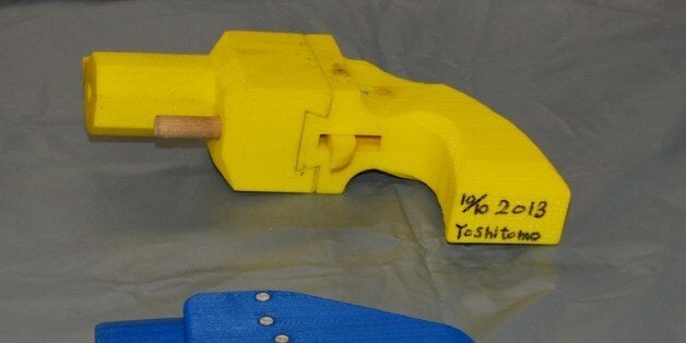 Seized plastic made guns produced by a 3-D printer are displayed at a police station in Yokohama on May 8, 2014. A Japanese man suspected of possessing guns made with a 3-D printer has been arrested in what was said to be the country's first such detention. Officers who raided the home of Yoshitomo Imura, a 27-year-old college employee, confiscated five weapons, two of which had the potential to fire lethal bullets. AFP PHOTO / JIJI PRESS JAPAN OUT (Photo credit should read JIJI PRESS/AFP/Getty Images)