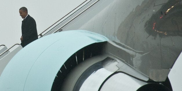 US President Barack Obama disembarks from Air Force One at Andrews sair Force Base in Maryland on April 29, 2014 upon his return from a six-day four-nation trip to Asia. AFP PHOTO/Nicholas KAMM (Photo credit should read NICHOLAS KAMM/AFP/Getty Images)