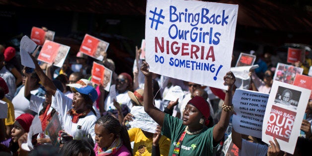 South Africans protest in solidarity against the abduction three weeks ago of hundreds of schoolgirls in Nigeria by the Muslim extremist group Boko Haram and what protesters said was the failure of the Nigerian government and international community to rescue them, during a march to the Nigerian Consulate in Johannesburg, South Africa Thursday, May 8, 2014. The kidnapping has ignited a viral social media campaign that has brought renewed attention to Boko Haram's campaign of violence, and protests around the world. (AP Photo/Ben Curtis)