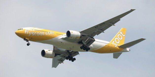 This photograph taken on May 4, 2014 shows a budget airline Scoot aircraft, a subsidiary of Singapore Airlines (SIA), approaching Changi International Airport in Singapore. AFP PHOTO / ROSLAN RAHMAN (Photo credit should read ROSLAN RAHMAN/AFP/Getty Images)