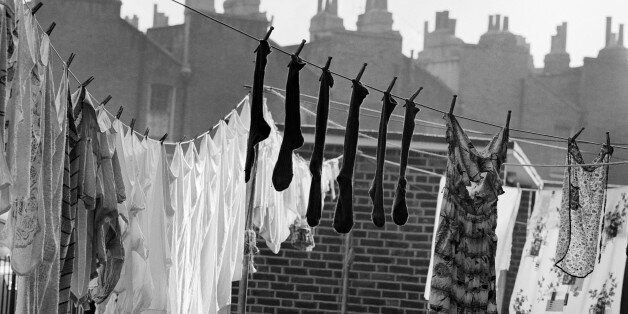 Laundry and chimneys, London, 1960-1965. A line of washing hanging out to dry on the roof. (Photo by English Heritage/Heritage Images/Getty Images)