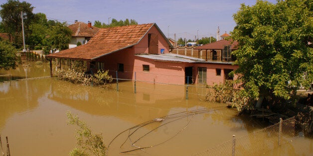 SARAJEVO, BOSNIA AND HERZEGOVINA - MAY 22: Flood victims still try to evacuate flood waters after the flood disaster in Sarajevo, Bosnia and Herzegovina on 22 May, 2014. (Photo by Denis Zuberi/Anadolu Agency/Getty Images)