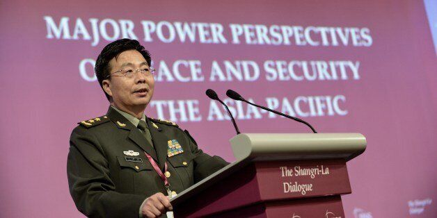 Deputy Chief of the General Staff of the People's Liberation Army (PLA) Wang Guanzhong speaks during the fourth plenary session at the 13th International Institute for Strategic Studies (IISS) Shangri-La Dialogue (SLD) in Singapore on June 1, 2014. China on June 1 strongly denounced Japanese Prime Minister Shinzo Abe and US defence chief Chuck Hagel for making 'provocative' speeches against Beijing. AFP PHOTO / ROSLAN RAHMAN (Photo credit should read ROSLAN RAHMAN/AFP/Getty Images)