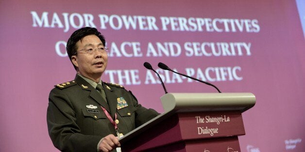 Deputy Chief of the General Staff of the People's Liberation Army (PLA) Wang Guanzhong speaks during the fourth plenary session at the 13th International Institute for Strategic Studies (IISS) Shangri-La Dialogue (SLD) in Singapore on June 1, 2014. China on June 1 strongly denounced Japanese Prime Minister Shinzo Abe and US defence chief Chuck Hagel for making 'provocative' speeches against Beijing. AFP PHOTO / ROSLAN RAHMAN (Photo credit should read ROSLAN RAHMAN/AFP/Getty Images)