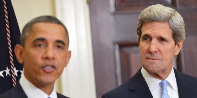 US Senator John Kerry D-MA (R) watches as US President Barack Obama announces Kerry as his choice for the next secretary of