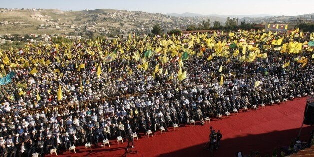 Lebanese supporters of Shiite Hezbollah movement gather in the southern town of Bint Jbeil, to watch a televised address by H