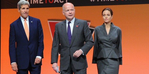 LONDON, ENGLAND - JUNE 13: United States Secretary of State John Kerry, British Foreign Secretary William Hague, UN Special Envoy and actress Angelina Jolie attend the Global Summit to End Sexual Violence in Conflict at ExCel on June 13, 2014 in London, England. The four-day conference on sexual violence in war is hosted by Foreign Secretary William Hague and UN Special Envoy and actress Angelina Jolie. (Photo by Eamonn M. McCormack/Getty Images)