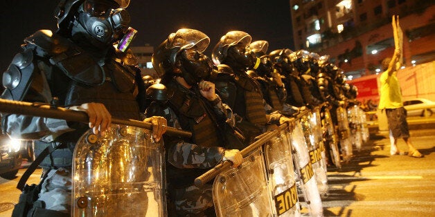 RIO DE JANEIRO, BRAZIL - JUNE 15: Military Police block anti-World Cup protestors attempting to march to Maracana stadium on June 15, 2014 in Rio de Janeiro, Brazil. Today is the fourth day of the 2014 FIFA World Cup. (Photo by Mario Tama/Getty Images)