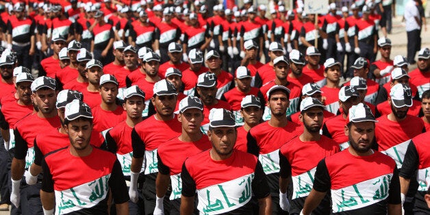 Members of the Iraqi Sadr Movement's Mahdi Army march in Baghdad's predominantly Shiite suburb of Sadr City on May 26, 2011 d