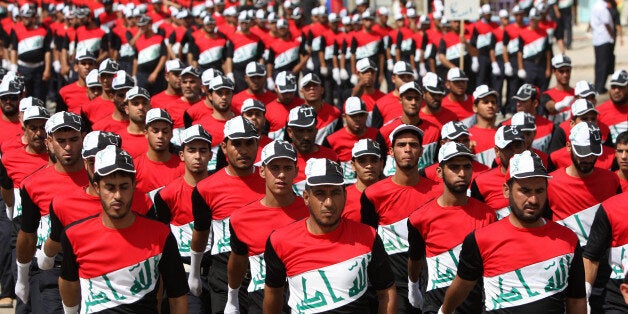 Members of the Iraqi Sadr Movement's Mahdi Army march in Baghdad's predominantly Shiite suburb of Sadr City on May 26, 2011 during a parade demanding the withdrawal of US forces from Iraq. AFP PHOTO/AHMAD AL-RUBAYE (Photo credit should read AHMAD AL-RUBAYE/AFP/Getty Images)