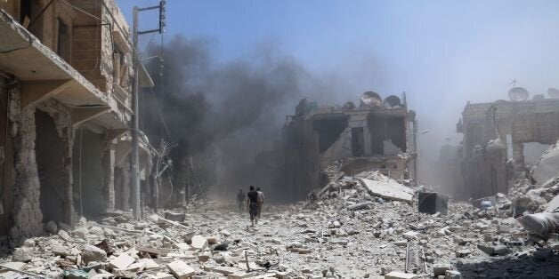 Rubble covers the street following an alleged airstrike by a Syrian army helicopter in the northern city of Aleppo, on June 11, 2014. More than 162,000 people have been killed in Syria since the conflict broke out in March 2011, the Syrian Observatory for Human Rights said in a new toll published on May 19. AFP PHOTO /ZEIN AL-RIFAI (Photo credit should read ZEIN AL-RIFAI/AFP/Getty Images)