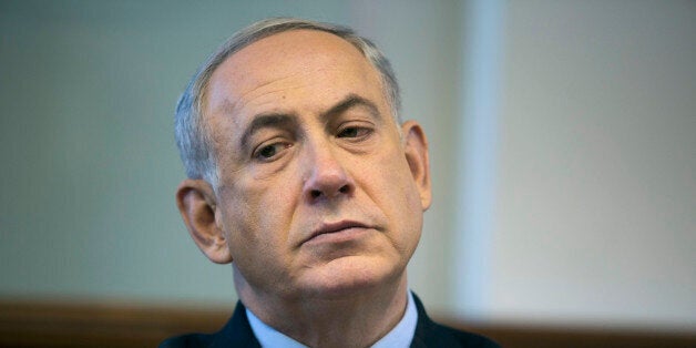 Israeli Prime Minister Benjamin Netanyahu chairs the weekly cabinet meeting at his office in Jerusalem on January 5, 2014. Is