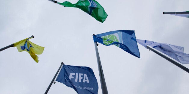 Flags of the World Soccer Association FIFA are seen in front of it's headquarter in Zurich, on October 20, 2010. FIFA has summoned senior Nigerian and Oceanian officials Amos Adamu and Reynald Temarii to a committee meeting on Wednesday which is investigating allegations of votes being sold in World Cup bidding. AFP PHOTO / SEBASTIAN DERUNGS (Photo credit should read SEBASTIAN DERUNGS/AFP/Getty Images)