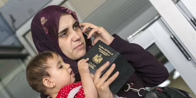 A Resident from the Gaza strip, holding dual citizenship, waits for clearance at Erez crossing in Beit Hanun in the north of