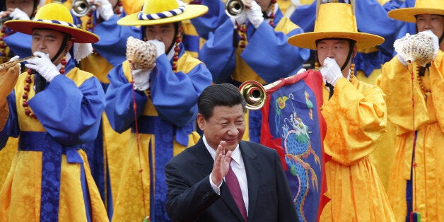 SEOUL, SOUTH KOREA - JULY 03: Chinese President Xi Jinping greets South Korean children during a welcoming ceremony held at