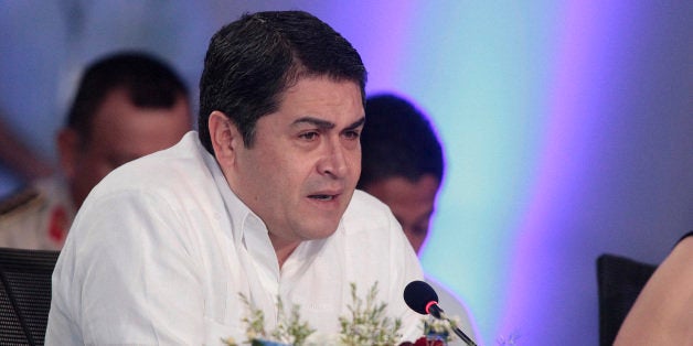 PUNTA CANA, DOMINCAN REPUBLIC - JUNE 27 : Juan Orlando Hernandez, president of Honduras during the XLIII Ordinary Summit of Central American Integration System (in spanish SICA) on June 27, 2014 in Punta Cana, Dominican Republic. The country members of Central American Integration System are Belize, Costa Rica, El Salvador, Guatemala, Honduras, Nicaragua, PanamÃ¡ and Dominican Republic. (Photo by Santiago Vidal/LatinContent/Getty Images)