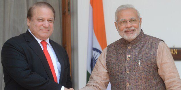 India's new Prime Minister Narendra Modi (R) shakes hands with Pakistani Prime Minister Nawaz Sharif during a meeting in New Delhi on May 27, 2014. Indian Prime Minister Narendra Modi met his Pakistani counterpart Nawaz Sharif for landmark talks in New Delhi May 27 in a bid to ease tensions between the nuclear-armed neighbours. AFP PHOTO/RAVEENDRAN (Photo credit should read RAVEENDRAN/AFP/Getty Images)