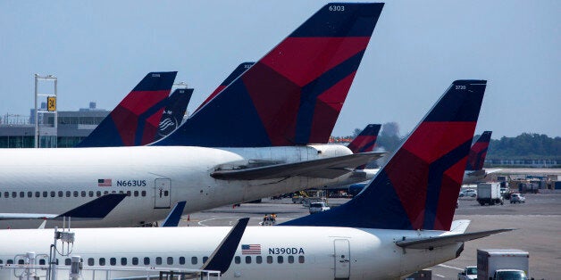 NEW YORK - JULY 22: Delta Airlines planes sit at Terminal 4 at John F. Kennedy Airport July 22, 2014 in New York City. The Federal Aviation Administration (FAA) has halted all flights from the U.S. to Tel Aviv, Israel following a rocket attack near Ben Gurion International Airport. (Photo by Eric Thayer/Getty Images)