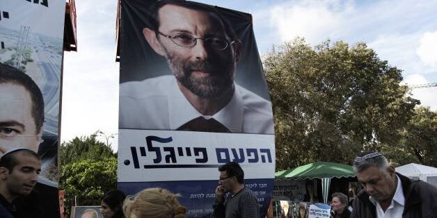 A campaign poster of Moshe Feiglin, hardline settler candidate for the ruling rightwing Likud party leadership primary ahead of a general election on January 22, is pictured on November 25, 2012 in Jerusalem. AFP PHOTO / MENAHEM KAHANA (Photo credit should read MENAHEM KAHANA/AFP/Getty Images)