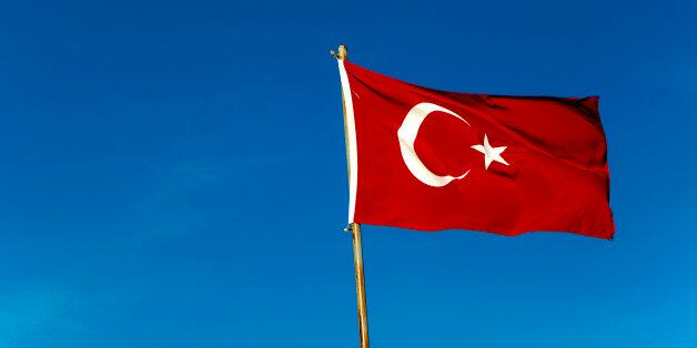 Turkish flag against blue sky