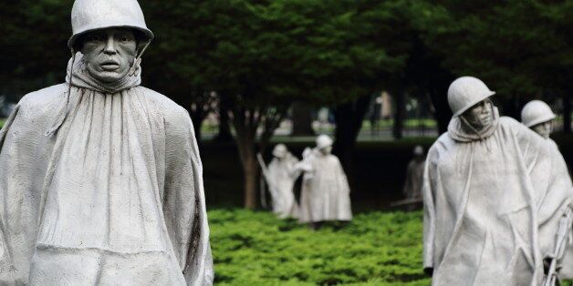 The Korean War Memorial, Washington, DC. The inscription reads: "Our nation honors her sons and daughters who answered the call to defend a country they never knew and a people they never met. 1950 - Korea - 1953" And "Freedom is Not Free"