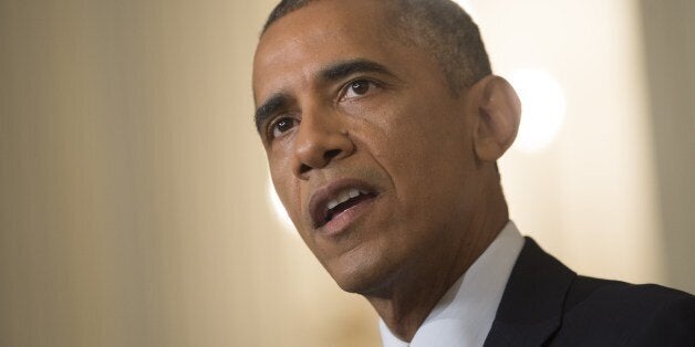 US President Barack Obama speaks about the situation in Iraq in the State Dining Room at the White House in Washington, DC, August 7, 2014. Obama said he authorized air strikes and relief supply drops in Iraq to prevent 'genocide' by Islamist extremists against minorities. 'We can act, carefully and responsibly, to prevent a potential act of genocide,' Obama said, in an address as he announced military action. AFP PHOTO / Saul LOEB (Photo credit should read SAUL LOEB/AFP/Getty Images)