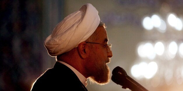 Iranian President Hassan Rouhani delivers a speech on the eve of the 25th anniversary of the Islamic revolutionary leader Aya