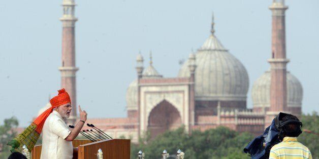 India's Prime Minister Narendra Modi (L) delivers a speech to mark the country's 68th Independence Day at the Red Fort in New Delhi on August 15, 2014. Modi condemned a spate of rapes as a source of shame for India and urged an end to communal violence on August 15 as he vowed to improve the lives of the nation's poor in his first Independence Day speech. AFP PHOTO / RAVEENDRAN (Photo credit should read RAVEENDRAN/AFP/Getty Images)