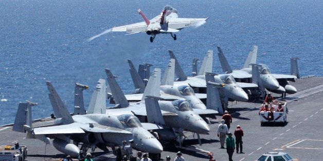 US fighters take off from the flight deck of the Nimitz-class USS George Washington for joint military exercises between the US and South Korea in South Korea's East Sea on July 26, 2010. The US and South Korea staged anti-submarine drills on July 26, the second day of a major naval exercise aimed at deterring North Korea despite its threats of nuclear retaliation. The two allies, who accuse the North of sending a submarine to torpedo a South Korean warship, have assembled about 20 ships including a 97,000-ton US aircraft carrier, 200 aircraft and 8,000 personnel. Seoul and Washington say the four-day exercise is intended to stress that future attacks will meet a decisive response. AFP PHOTO / POOL / Lee Jin-man (Photo credit should read LEE JIN-MAN/AFP/Getty Images)