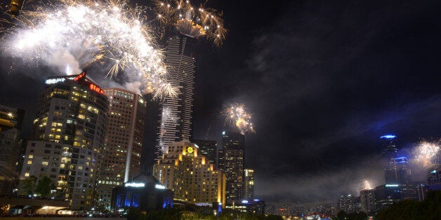 MELBOURNE, AUSTRALIA - DECEMBER 31: Fireworks over Melbourne skyline and Yarra River during New Years Eve fireworks on Decem
