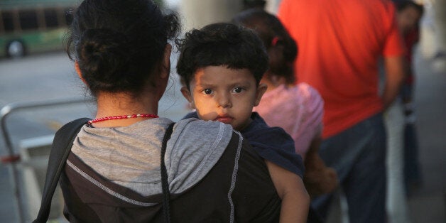 MCALLEN, TX - JULY 25: Salvadorian immigrants just released from U.S. Border Patrol detention wait at the Greyhound bus station for their journey to Houston on July 25, 2014 in McAllen, Texas. Federal agencies have been overwhelmed by tens of thousands of immigrant families and unaccompanied minors from Central America crossing illegally into the United States. Many are being processed and released within days, with a requirement to enter immigration court proceedings at a later date. Texas' Rio Grande Valley has become the epicenter of the latest immigrant crisis, as more Central Americans have entered from Mexico into that sector than any other stretch of America's 1,933 mile border with Mexico. (Photo by John Moore/Getty Images)