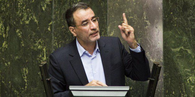 Iranian Minister for Science, Research and Technology, Reza Faraji Dana, addresses the parliament during his impeachment process in Tehran on August 20, 2014. Iran's conservative-dominated parliament voted to sack the science minister for wanting to recruit people accused of involvement in the 2009 protest movement. AFP PHOTO/BEHROUZ MEHRI (Photo credit should read BEHROUZ MEHRI/AFP/Getty Images)
