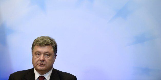 Ukrainian President Petro Poroshenko holds a press conference on the sidelines of a European Union summit at the EU Headquarters in Brussels on August 30, 2014. The European Union geared up a fresh wave of sanctions against Russia with warnings that the escalating conflict in Ukraine was putting all of Europe at risk of war. AFP PHOTO/JOHN THYS (Photo credit should read JOHN THYS/AFP/Getty Images)