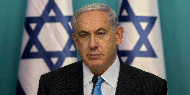 Israeli Prime Minister Benjamin Netanyahu sits during a press conference at the prime minister's office in Jerusalem, Wednesday, Aug. 27, 2014. Israel's prime minister declared victory Wednesday in the recent war against Hamas in the Gaza Strip, saying the military campaign had dealt a heavy blow and a cease-fire deal gave no concessions to the Islamic militant group.(AP Photo/Sebastian Scheiner)