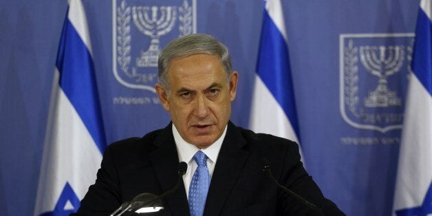 Israeli Prime Minister Benjamin Netanyahu speaks during a joint press conference with Defense Minister (unseen) at the defense ministry in the coastal city of Tel Aviv on August 2, 2014. Israel will continue its military campaign in the Gaza Strip for as long as needed and with as much force as necessary,Netanyahu said. AFP PHOTO/GALI TIBBON (Photo credit should read GALI TIBBON/AFP/Getty Images)