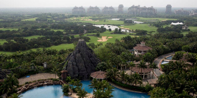 A swimming pool sits near the golf course and residential properties at Mission Hills Resort Haikou in Haikou, Hainan Province, China, on Saturday, April 5, 2014. The yuan is poised to recover from declines that have made it Asias worst-performing currency as China seeks to prevent an exodus of capital that would threaten economic growth, according to the most accurate forecasters. Photographer: Brent Lewin/Bloomberg via Getty Images