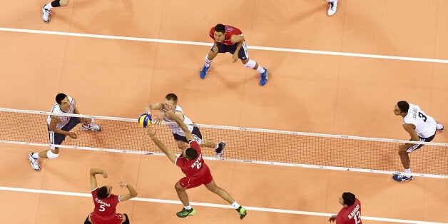 CRACOW, POLAND - SEPTEMBER 02: David Smith of USA and Iran's Seyed Mohammad Mousavi Eraghi fight for the ball on the net during the FIVB World Championships match between USA and Iran at Cracow Arena on September 2, 2014 in Cracow, Poland. (Photo by Adam Nurkiewicz/Getty Images)