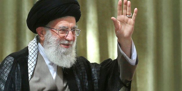 In this picture released by an official website of the office of the Iranian supreme leader, Supreme Leader Ayatollah Ali Khamenei waves to the crowd while attending a ceremony marking 25th death anniversary of the late revolutionary founder Ayatollah Khomeini at his shrine just outside Tehran, Iran, Wednesday, June 4, 2014. (AP Photo/Office of the Iranian Supreme Leader)