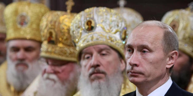 Russian Premier Vladimir Putin (R) attends the enthronement ceremony of Russian Orthodox Patriarch of Moscow and All Russia Kirill in Christ the Savior cathedral in Moscow on February 1, 2009. The Russian Orthodox Church on February 1 enthroned its first new leader of post-Soviet times, Patriarch Kirill, in a ceremony attended by political leaders. AFP PHOTO / RIA NOVOSTI / POOL / ALEXEY DRUZHININ (Photo credit should read ALEXEY DRUZHININ/AFP/Getty Images)