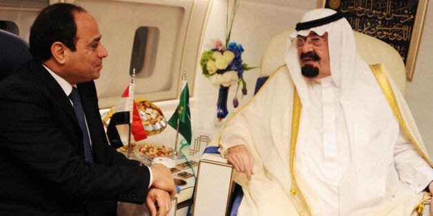 CAIRO, EGYPT - JUNE 20: Saudi King Abdullah bin Abdulaziz (R) and Egyptian President Abdel-Fattah al-Sisi (L) meet on board the former's royal plane in Cairo, Egypt on June 20, 2014. (Pool-Egyptian Presidency/Anadolu Agency/Getty Images)