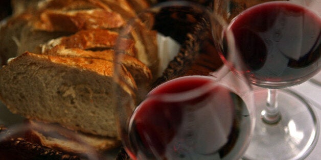 TEL AVIV, ISRAEL - MARCH 25: Fresh country bread and red wine are served with lunch at the Carmella Banahela bistro on March 25, 2008 in Tel Aviv, Israel. World food prices are soaring in the face of what some analysts are describing as a perfect storm of circumstances; increasing demand from developing economies in Asia, rising fuel prices, severe weather impacting recent harvests and an economic shift to biofuel production. All this leaves the consumer paying more for basic staples such as bread and milk and is likely to have its hardest impact on poorer nations. (Photo by David Silverman/Getty Images)