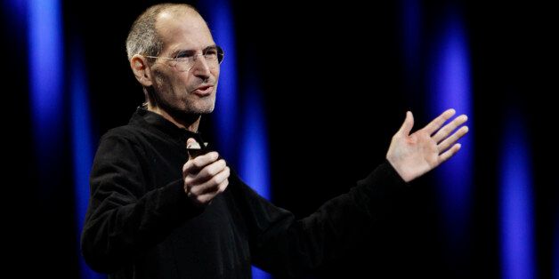 Apple CEO Steve Jobs gestures to his audience during a keynote address to the Apple Worldwide Developers Conference in San Francisco, Monday, June 6, 2011. (AP Photo/Paul Sakuma)