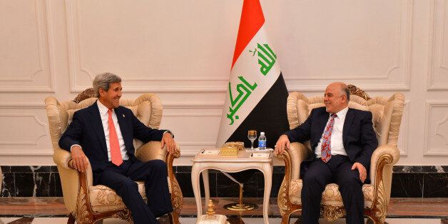 BAGDAD, IRAQ - SEPTEMBER 10: Secretary of State John Kerry (L) meets with Haider al-Abadi (R), Prime Minister of Iraq in Bagdad capital of Iraq, on September 10, 2014 (Photo by Pool/Iraqi Prime Ministery/Anadolu Agency/Getty Images)