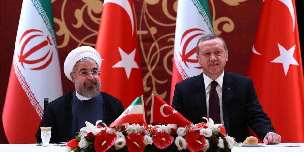 ANKARA, TURKEY - JUNE 9: Turkish Prime Minister Recep Tayyip Erdogan (R) meets with Iranian President Hasan Rouhani (L) at Ankara Palace during business lunch on June 9, 2014 in Ankara, Turkey. (Photo by Kayhan Ozer/Anadolu Agency/Getty Images)