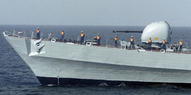 Arabian Sea, PAKISTAN: Pakistani sailors stand on the Tipu Sultan warship during the multinational naval exercise 'AMAN 07' (Peace) in the Arabian Sea off Karachi, 08 March 2007. Naval warships from nine nations began a joint exercise in Pakistan aimed at boosting cooperation to combat terrorism at sea. The naval forces and warships of Britain, Bangladesh, China, France, Italy, Malaysia, Turkey and the United States are taking part in exercises along with host Pakistan. AFP PHOTO/Asif HASSAN (Photo credit should read ASIF HASSAN/AFP/Getty Images)