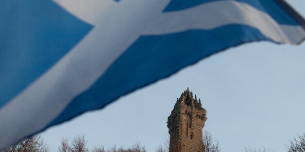 A Scottish Saltire flag blows in the wind near the Wallace Monument, Stirling, Scotland. Thursday, Jan. 12 2012. This week the Scottish Government has announced that they wish to hold an independence referendum in 2014. (AP Photo/Chris Clark)