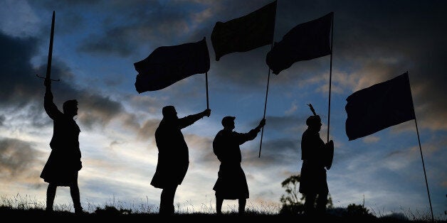 LOCH LOMOND, SCOTLAND - SEPTEMBER 14: Duncan Thomson, Brian McCutcheon, John Patterson and Arthur Murdoch,from King of Scots Robert the Bruce Society, hold the Scottish flags as they prepare to vote in the Scottish independence referendum on September 14, 2014 in Loch Lomond. The latest polls in Scotland's independence referendum put the No campaign back in the lead, the first time they have gained ground on the Yes campaign since the start of August. (Photo by Jeff J Mitchell/Getty Images)