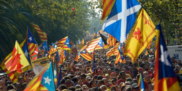 A Saltire flag, top right, is seen amongst âesteladaâ flags, symbolizing Catalonia's independence, during a demonstration calling for the independence of Catalonia in Barcelona, Spain, Thursday, Sept 11, 2014. A week before Scotland votes on whether to break away from the United Kingdom, separatists in northeastern Spain were trying to convince hundreds of thousands to protest across Catalonia to demand a secession sentiment vote that the central government in Madrid insists would be illegal. AP Photo/Manu Fernandez)